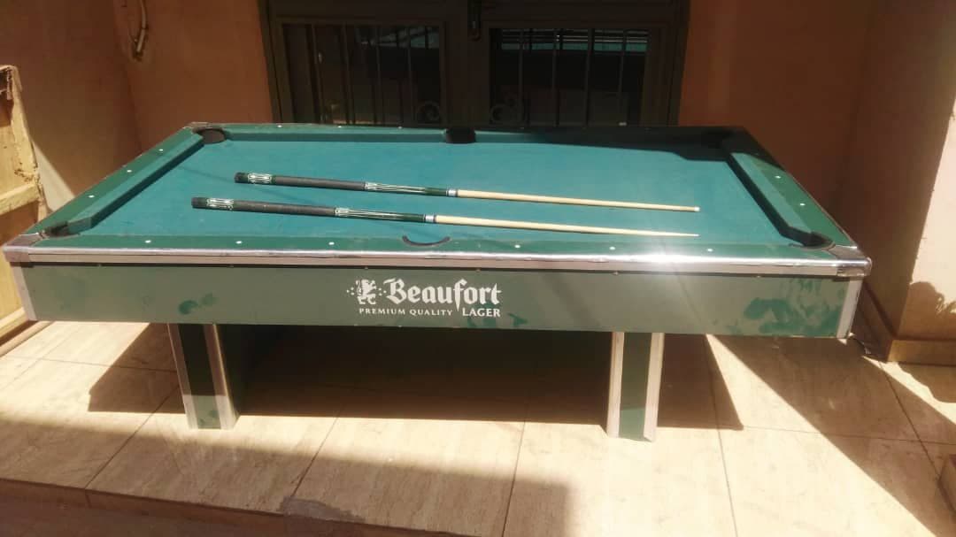 Pool table with cues and