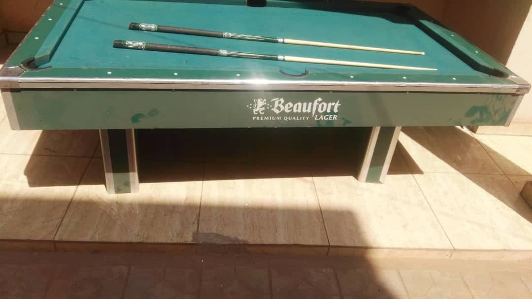 Pool table with cues and