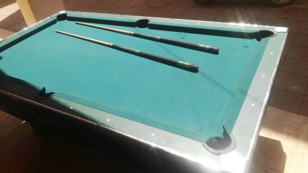 Pool table with pool cue