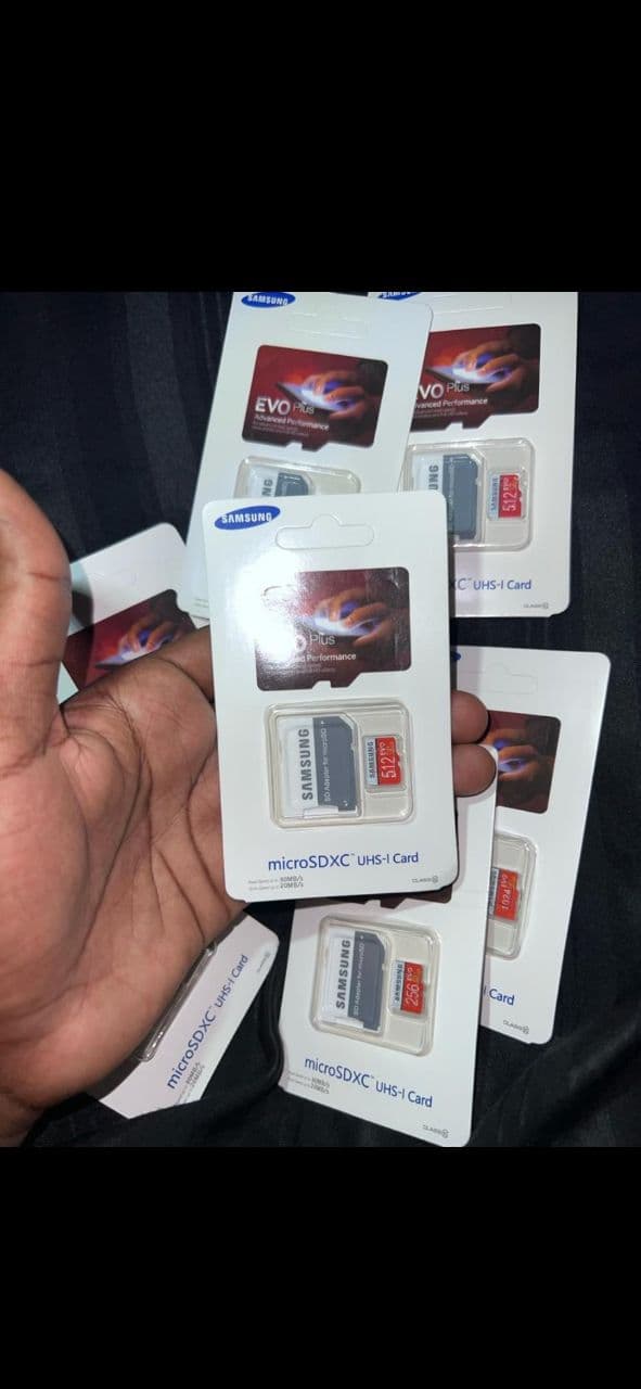 Hand holding four sim cards