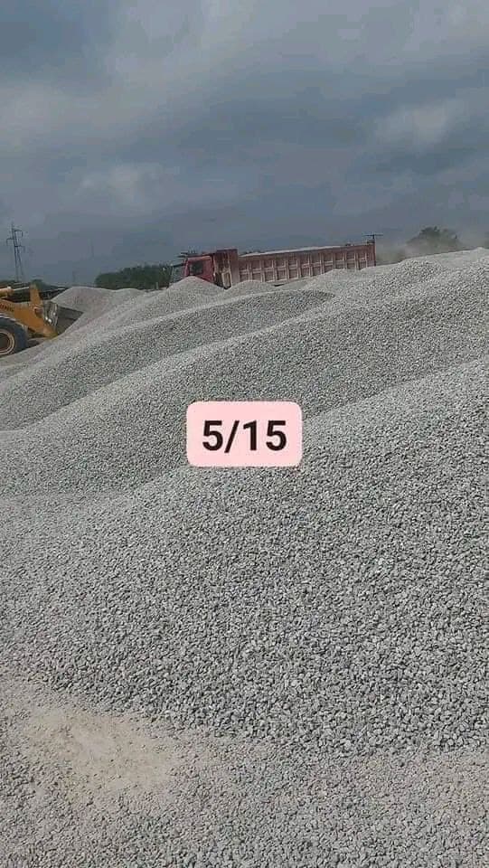Pile gravel with pink sign